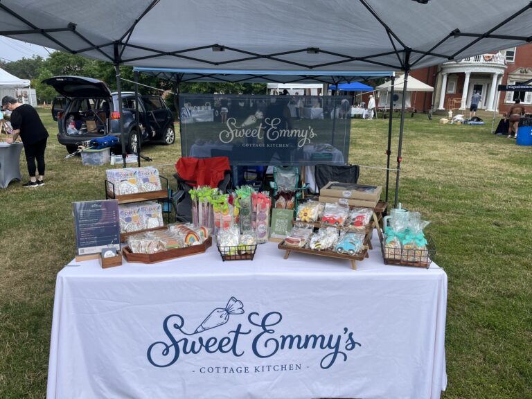 Sweet Emmy’s market booth with packaged cookies and decorating kits