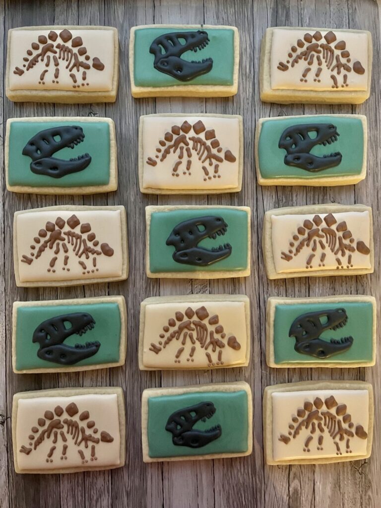 Sweet Emmy’s dinosaur skeleton cookies with piped icing