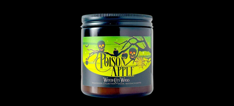 Witch City Wicks Poison Apple candle in an amber jar