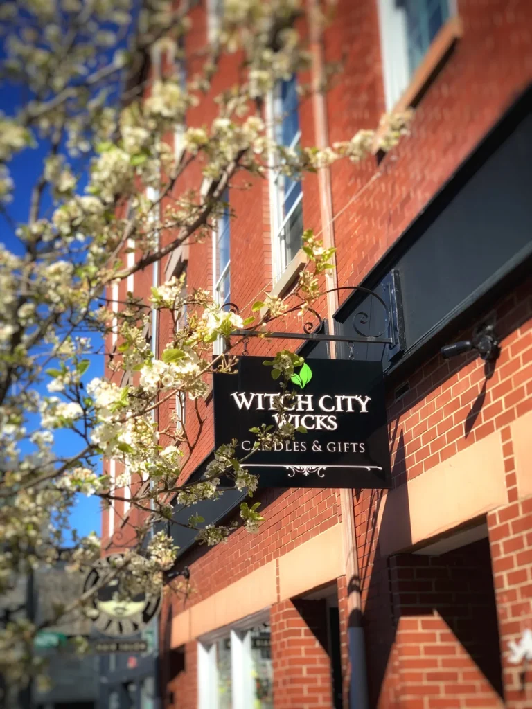 Witch City Wicks storefront sign on Essex Street in Salem