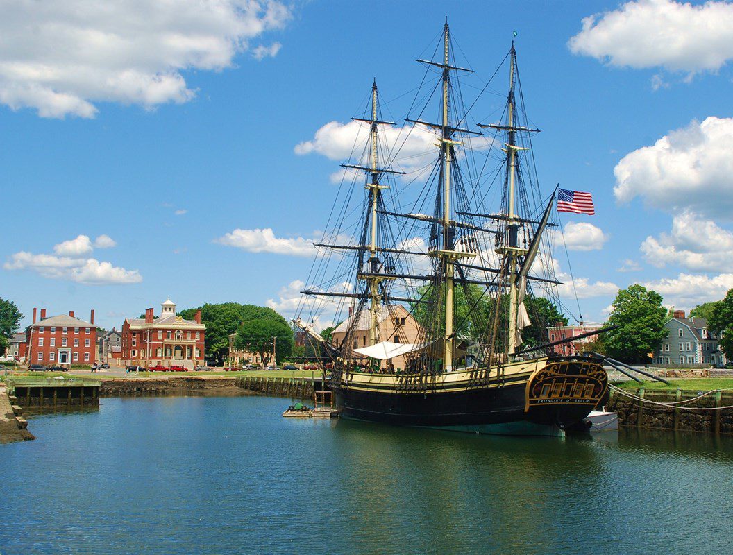Friendship of Salem docked beside the historic brick buildings along Derby Wharf.
