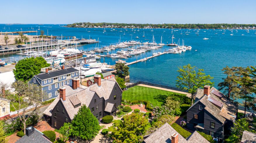 Aerial view of The House of the Seven Gables, its gardens and Salem Harbor.